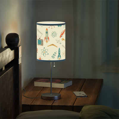 Table lamp with a colorful design on a wooden nightstand in a dimly lit room.