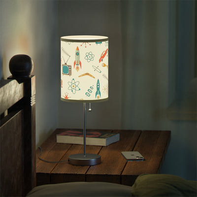 Table lamp with a colorful design on a wooden nightstand in a dimly lit room.