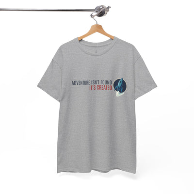 Gray t-shirt with adventure quote and graphic on a hanger against a white background
