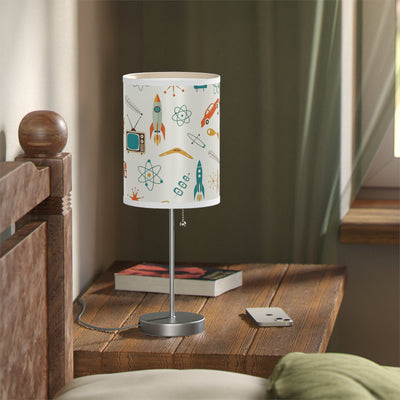 Table lamp with a colorful design on a wooden nightstand in a bedroom setting.