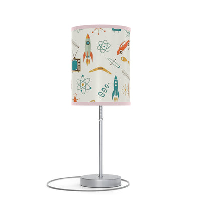 Table lamp with a colorful lampshade featuring retro icons on a white background