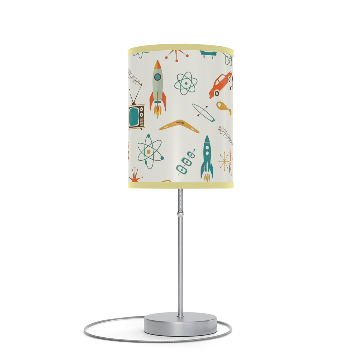Table lamp with a colorful lampshade featuring space-themed designs on a white background.
